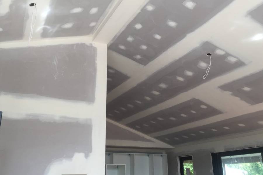 New ceiling and plastering works in progress during an Addition & Alteration project