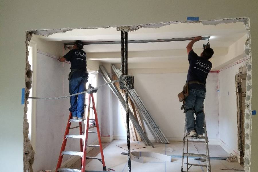 Contractors carrying out structural opening and reinforcement works on site