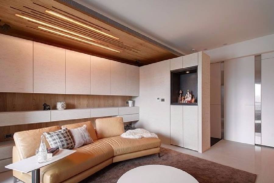 Resale HDB living room with wood-panel ceiling feature and display shelf