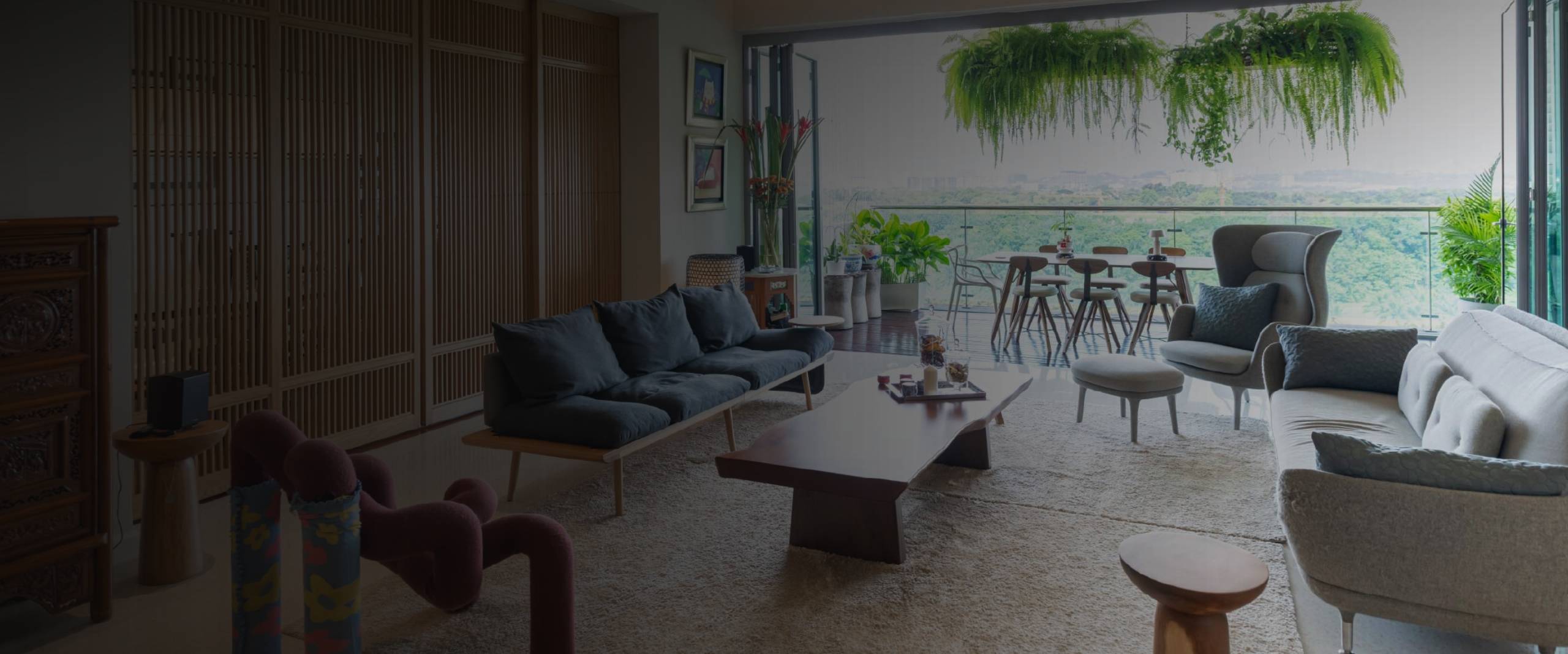 Renovated open-concept living room in Singapore with wood slat feature wall, navy sofa and balcony access by Thomson Renovation Contractor